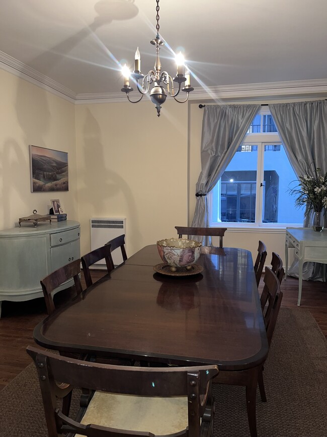 Dining chairs have been recently recovered in a soft muted gold palette. - 1880 Jackson St