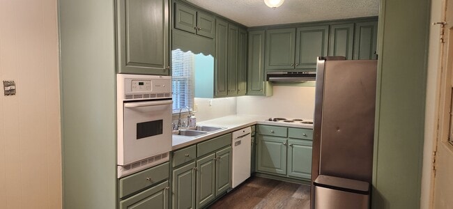Freshly painted kitchen with new cabinet doors - 5787 Lorraine Dr House