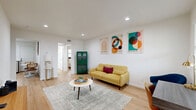 Located at 5203 Gaston Ave in Dallas's vibrant 75214 corridor, this well-designed one-bedroom, one-bathroom unit offers a thoughtful layout across a single floor. Light wood flooring flows throughout, lending warmth and visual continuity to every room.

The living area is bright and open, with recessed lighting, crisp white walls, and a window that invites natural light. A built-in media ledge adds a functional architectural touch to the space.

The kitchen is a standout, featuring two-tone cabinetry — white upper cabinets paired with rich dark lower cabinets — white quartz countertops, a classic subway tile backsplash, and a full suite of stainless steel appliances including a refrigerator, range, microwave, and dishwasher. A window above the sink brings in additional light.

The bedroom is a comfortable, well-proportioned retreat with a ceiling fan, natural light from a window, and direct access to the bathroom. The bathroom is clean and functional, finished in white tile with a full tub-shower combination and a small window for ventilation.

Additional conveniences include a pantry, a dedicated closet, and in-unit laundry. A cozy dining nook completes this efficiently designed, move-in ready home.