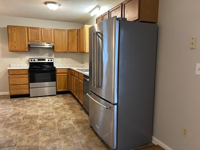 The kitchen has a laundry room that includes washer/dryer hookups - 4684 Coltsfoot Rd