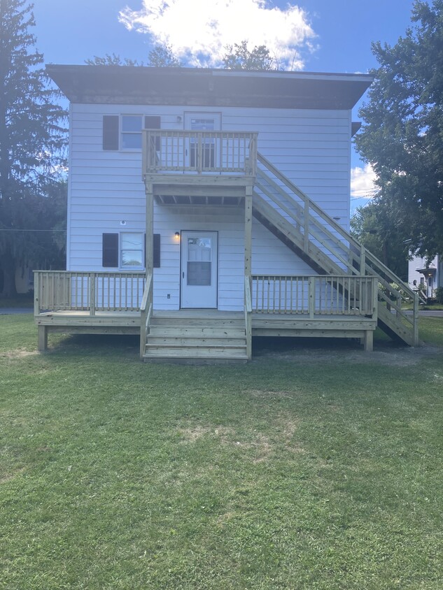 Back of house with stairway leading to second floor apartment. - 12 Baker St