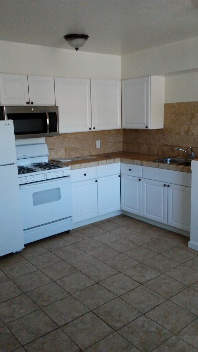 Kitchen cabinetry and appliances - 7629 Normal Ave
