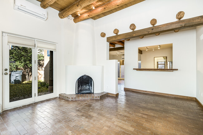 Living Room with Wood Burning Fireplace - 655 Galisteo St