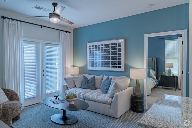 2BR, 2BA - 1,064SF - Living Room - Evolve at the Pines