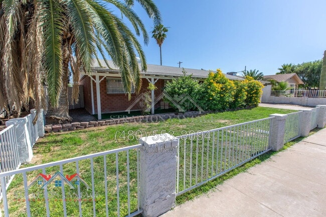 Building Photo - 8119 E Amelia Ave