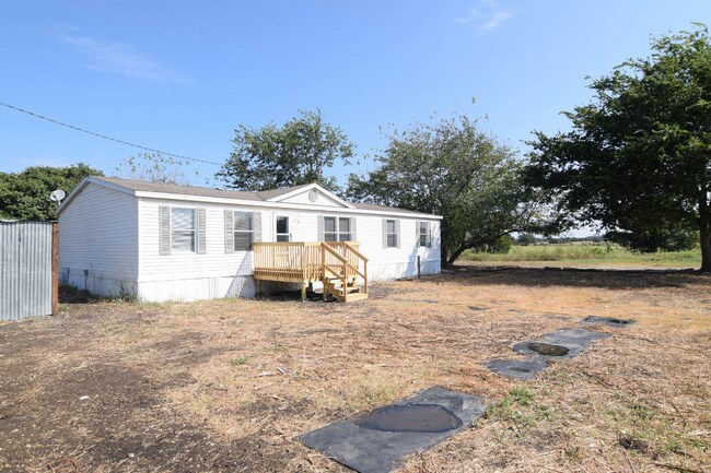 Building Photo - 9950 E Trimmier Rd