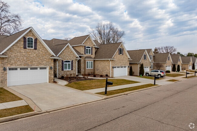 Intricate masonry on this brick Tudor in Grand Blanc.