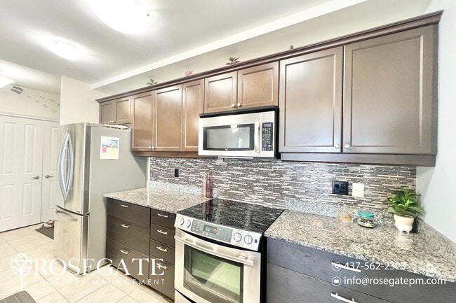 Building Photo - Modern 2-Bedroom + Den Condo with Stunning...