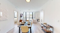 This contemporary residence at 122 NW 25th St, Miami, FL, offers a blend of comfort and style within its 1190 square feet of living space. The single-story layout encompasses five bedrooms and five bathrooms, providing ample room for family living or guest accommodation. The primary bedroom, measuring 130 square feet, serves as a generous private retreat.

The interior showcases a modern aesthetic with clean lines and a neutral color palette. Light wood flooring runs throughout, creating a seamless flow between spaces. The open-concept design is evident in the living and dining areas, where a sleek dining table with white chairs complements the minimalist decor. Large windows allow natural light to flood the rooms, enhancing the sense of spaciousness.

Bedrooms feature plush, white bedding and custom headboards, with pops of color added through accent pillows. The bathrooms boast a spa-like ambiance with glass-enclosed showers, stone-effect flooring, and contemporary fixtures. Built-in storage solutions, including closets with shelving and drawers, maximize the use of space.

The property's attention to detail is evident in its carefully curated furnishings and fixtures, from the pendant lighting to the strategically placed artwork. This Miami residence offers a turnkey living experience that combines functionality with modern urban sophistication.