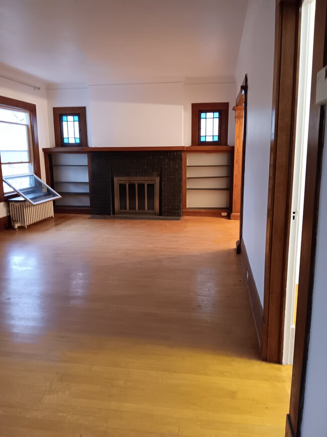 Living room fireplace with original bookcases - 2114 Penn Ave S