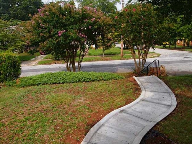Walk up to rocking chair from porch. Enjoy a glass of wine or coffee on the swing. - 1733 Melrose Dr SW