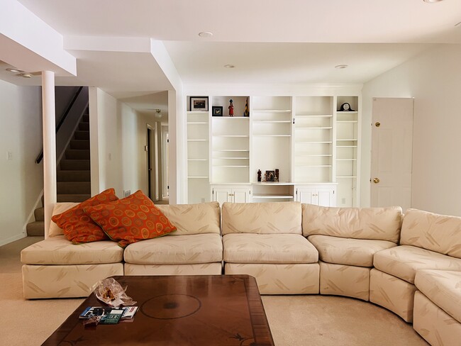 Wall shelf & L shaped sofa living room - 9806 Kentsdale Dr
