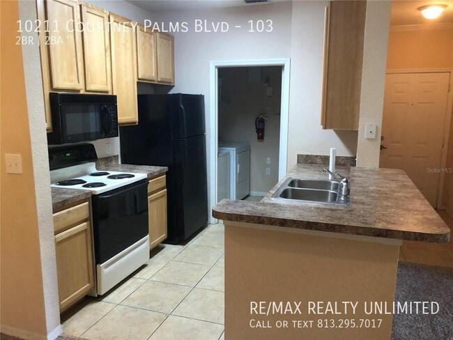 Building Photo - 10211 Courtney Palms Blvd