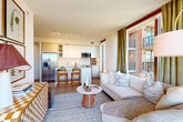 Located at 650 Howard Rd SE in Washington, DC, this thoughtfully designed one-bedroom, one-bathroom residence offers a smart, efficient layout across a single floor. The open-concept kitchen and living area serves as the heart of the home, featuring light wood-toned cabinetry, stainless steel appliances, a sleek breakfast bar, and light hardwood-style flooring that flows throughout the space. Floor-to-ceiling windows with warm wood-framed accents flood the living area with natural light and frame stunning treetop and cityscape views, while a private patio extends the living space outdoors.

The bedroom is generously sized, outfitted with large windows that capture abundant natural light and panoramic green views, creating a serene and airy retreat. Two closets provide ample storage. The bathroom features a full tub-shower combination, a wide vanity with a clean white countertop, and neutral tile finishes. A clean white hallway with recessed lighting and light hardwood floors connects all areas of the residence seamlessly. Additional highlights include a dedicated office space, an in-unit laundry area, and a utility room, offering practical convenience throughout. The overall ambiance is modern, bright, and welcoming.