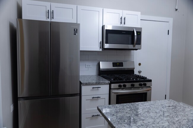 Stainless Steel appliances including large fridge with bottom freezer - 1537 N Talman Ave