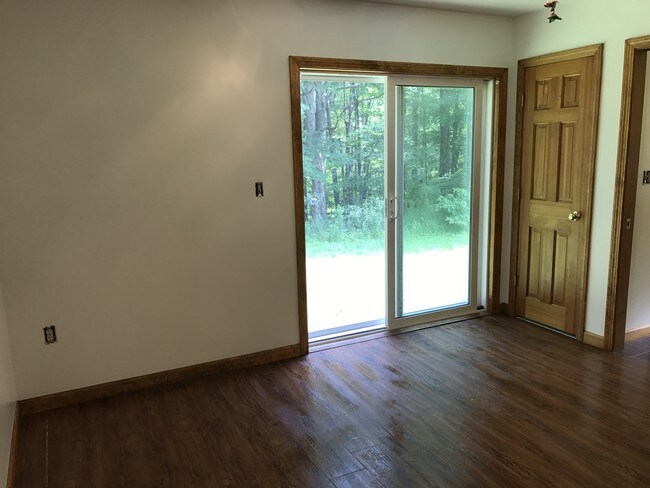 Bedroom slider to outside grassy area - 310 Westford Rd