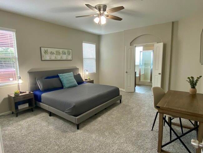 Primary Bedroom with a Smart TV and designated work space - 25526 Dappled Filly Dr