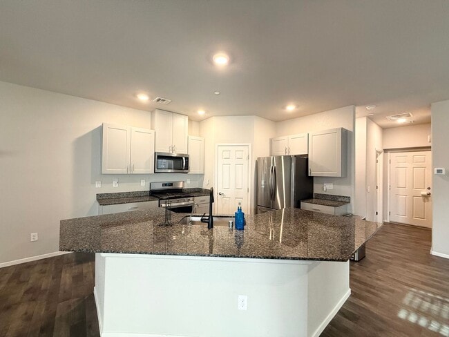 Building Photo - Modern 3-Bedroom townhome with Open Layout, Community Pool & Prime Location