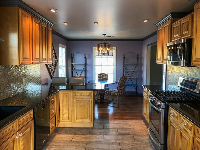 kitchen - stainless steel appliances, granite countertops, slate floors, custom cabinetry, bar area - 3200 S Van Buren St