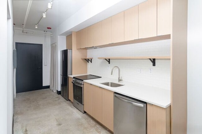 Building Photo - Check out this studio ! We want you to cal...