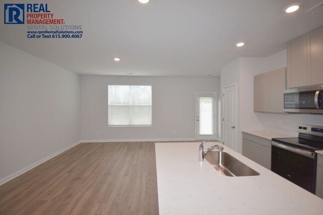 Photo - Like new 3bd townhome w/ attached 2 car garage & community pool! Washer/dryer included!