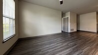 This contemporary single-story home in Fleetwood, Noblesville, offers 940 square feet of thoughtfully designed living space. The property boasts three bedrooms, including a primary bedroom of 140 square feet, and two full bathrooms. The open-concept floor plan seamlessly integrates the kitchen and living areas, creating a spacious feel and facilitating easy movement throughout the home.

The interior is characterized by modern finishes, including sleek wood-look flooring that runs consistently through most rooms, providing a cohesive and stylish appearance. The bathrooms feature a combination of this flooring and white fixtures, with one bathroom showcasing a glass-enclosed shower and the other a full-size bathtub.

The kitchen is equipped with stainless steel appliances, white cabinetry, and dark countertops, offering both functionality and visual appeal. Large windows in the bedrooms allow for ample natural light, while carpeting in these areas adds comfort underfoot.

Storage solutions include built-in closets and shelving units, maximizing the use of available space. The neutral color palette throughout the home creates a bright, airy atmosphere and provides a versatile backdrop for various decor styles.

This efficiently designed home in the 46060 zip code area combines modern amenities with practical living spaces, making it an attractive option for those seeking contemporary comfort in Noblesville, Indiana.