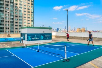 Stay active and social with a match on our premier pickleball courts - Newport Rentals