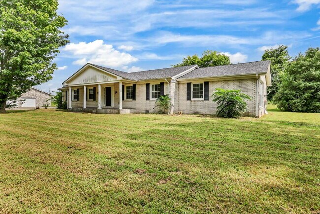 Building Photo - spacious 4-bedroom, 2.5-bath home featuring a 2-car garage and fresh updates throughout.