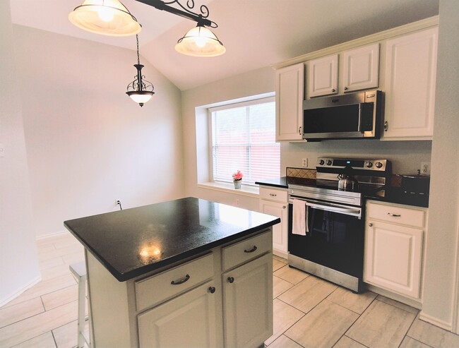 Kitchen with island - 5802 Edinburg Dr