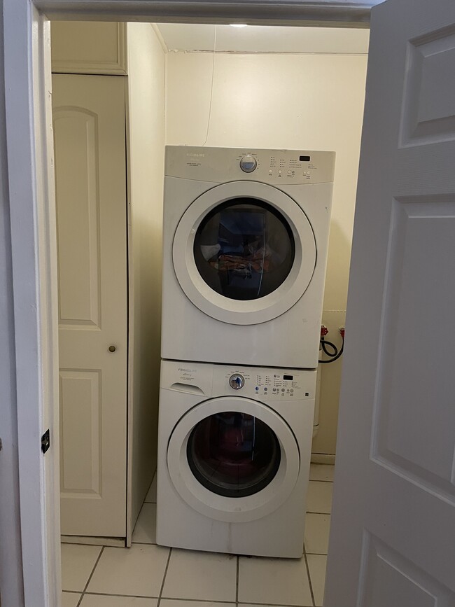 Washer and dryer. Water heater is in the cabinet to the left. - 1230 Mandeville St