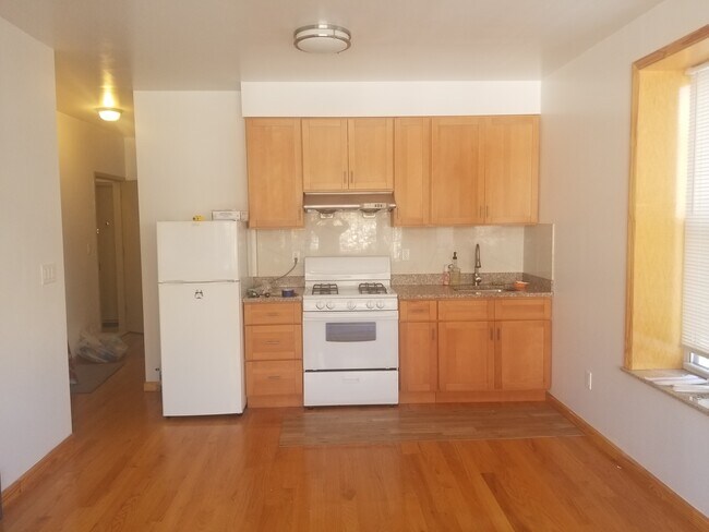 Open kitchen with ample cabinet space *Utilities are included* - 330 68th St