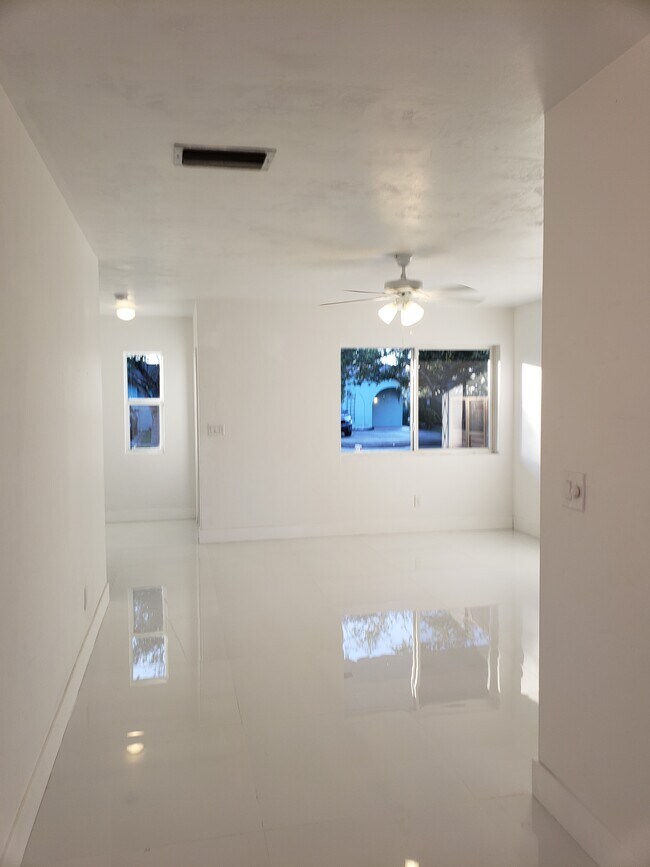 Another view of the front entrance, living room from the dining room, kitchen - 11557 SW 81st Rd