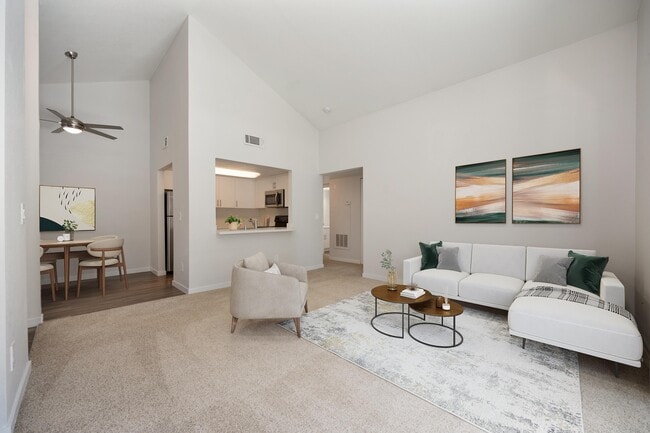 Living room with vaulted ceilings - Rush River Apartments