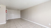 Located at 9550 Long Point Rd in Houston, TX, this two-story home offers a practical and well-organized layout across two floors. The main level features a welcoming living room filled with natural light from a large front-facing window, neutral-toned walls, and clean light-tiled flooring that extends throughout the ground floor. A carpeted staircase connects the two levels, adding a warm contrast to the tile. The kitchen is supported by a dedicated pantry, providing excellent storage for everyday living. The upper floor hosts all three bedrooms, including a generously sized primary bedroom, each outfitted with ceiling fans and windows that bring in outdoor light and views. Five closets are distributed throughout the home, offering abundant storage. The four bathrooms are consistently appointed with granite-topped vanities, white cabinetry, large mirrors, and tile flooring. Select bathrooms feature a tub-shower combination with bold marble-style tiled surrounds, adding a striking visual element. A dedicated laundry room adds everyday convenience. Throughout the home, a cohesive neutral color palette, textured ceilings, and white trim create a clean, move-in-ready atmosphere.