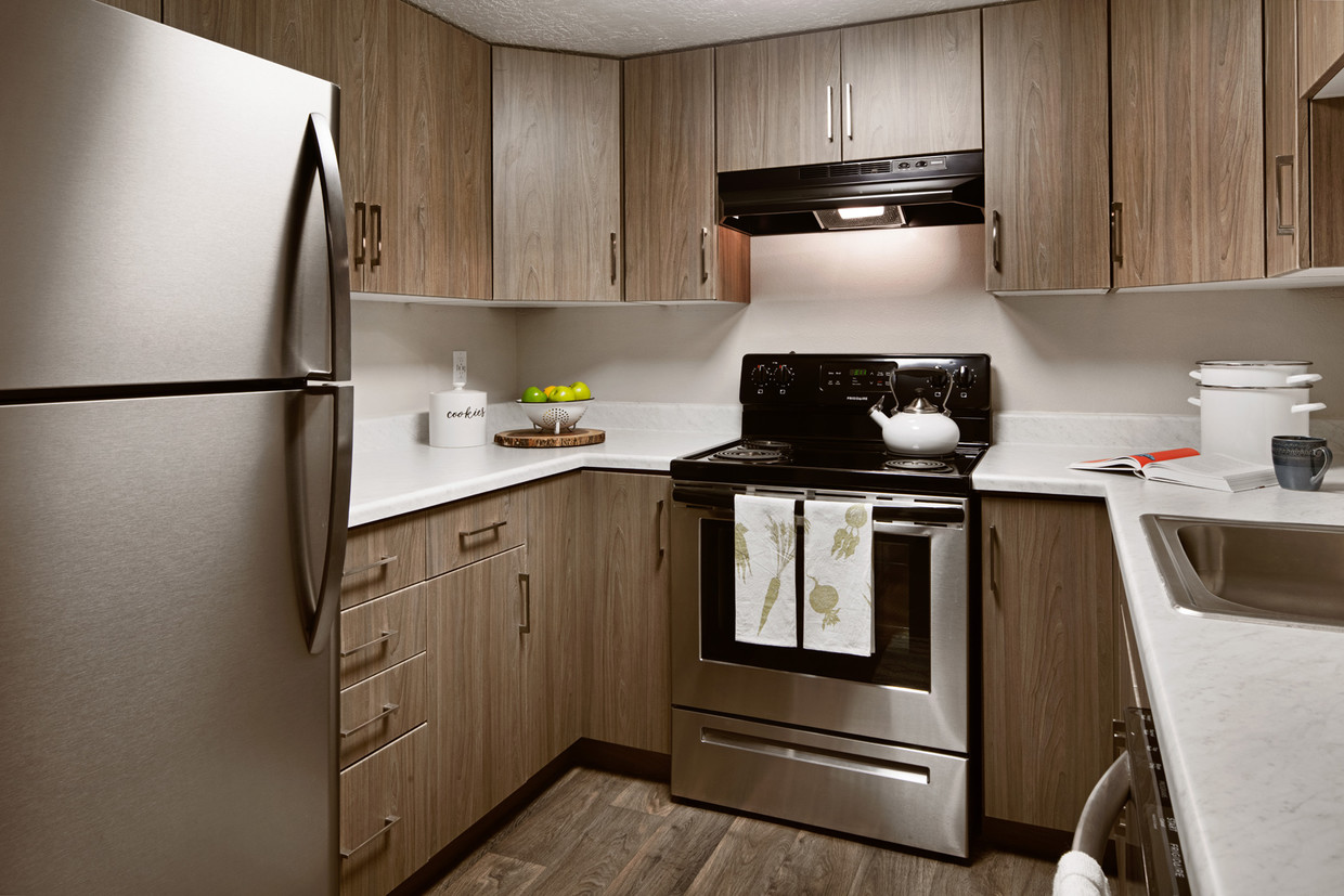 Estufa de cocina y gabinetes de los Clover Creek Apartments - Clover Creek