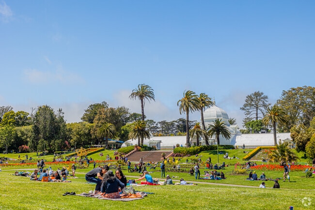 People enjoying a warm summer day at Golden Gate Parks Conservancy Of Flowers.