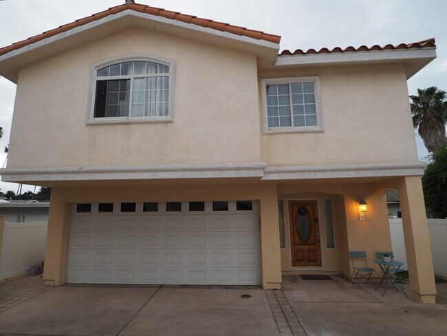 Private gated entrance is to the left of the garage in this back unit B - 707 N Irena Ave