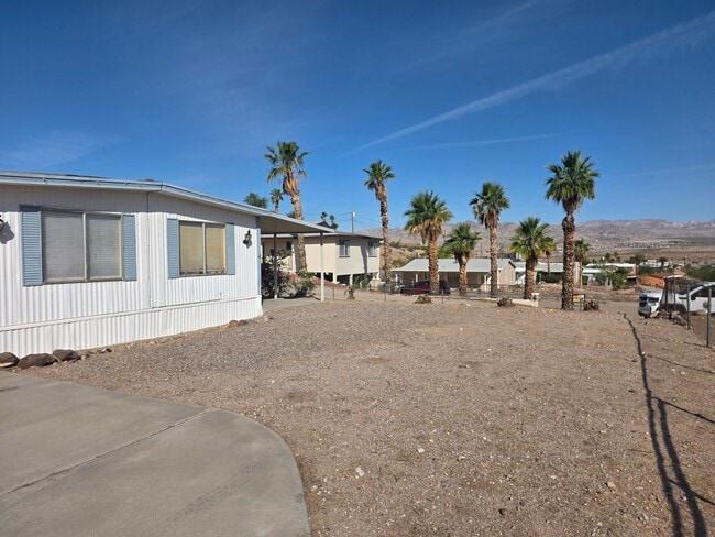 Building Photo - LAND, LAND AND MORE LAND! 2 bed/2 bath Manufactured home in Bullhead City on Huge double lot!