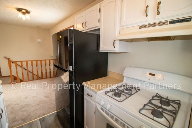 Building Photo - 2-Bed, 1-Bath Upper Unit with Garage & Porch – Steps from Paul Henry Trail