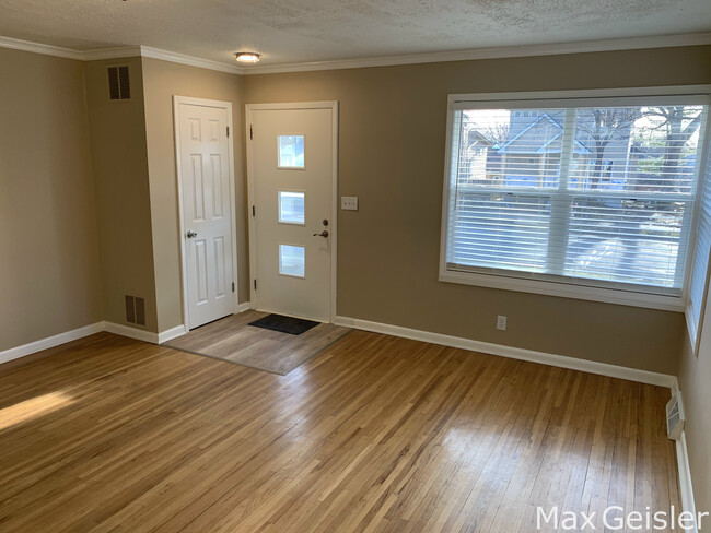 Cozy living room with view of family neighborhood. - 404 12th Ave N