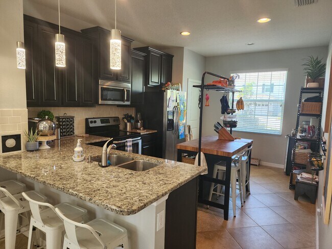 Kitchen and Bar Area - 6413 Boxgrove Dr
