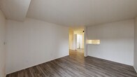 Located at 2074 Weldon Ln in Bay Point, CA, this single-floor, one-bedroom, one-bathroom residence offers a practical and well-organized layout. The living room features light wood-style laminate flooring, a textured ceiling, and a sliding glass door fitted with vertical blinds that invites natural light and provides outdoor access. A pass-through counter connects the living area to the kitchen, enhancing the open feel of the shared space.

The galley-style kitchen is efficiently designed with white cabinetry lining both sides, marble-patterned countertops, a gas range, a refrigerator, a stainless steel sink, and a skylight overhead that brightens the space naturally. A ceiling fan is also present, adding to the kitchen's functionality.

The bedroom is carpeted for comfort and features a window with vertical blinds, offering a quiet and well-lit retreat. A closet provides dedicated storage within the unit. The bathroom is clean and straightforward, featuring a tub-shower combination, a single vanity with marble-style countertop, white cabinetry, and a large mirror. Throughout the unit, neutral tones and consistent finishes create a cohesive and move-in-ready environment.