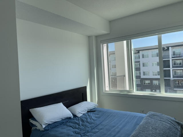 Building Photo - Modern 2 Bedroom + Den Condo with Underground Parking in Skyview Ranch (IP054)