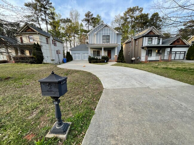 Street View (6 Car Driveway, 2 Car Garage w/Attic Storage, Front Porch w/Bench, Privacy Mail Box) - 209 Hilltop Dr SW