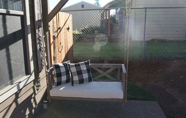 Attached porch swing. - 38438 Galway St