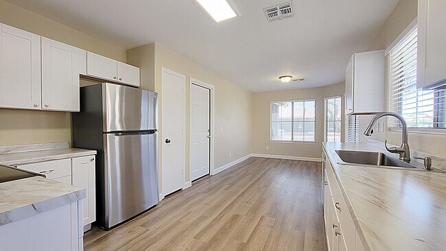 Building Photo - New flooring and paint!  Highly sought aft...