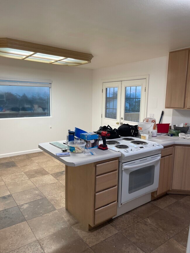 Kitchen into Dining - 3801 S Franklin Rd