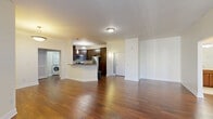 Located at 530 E Ohio St in Indianapolis, this well-appointed 2-bedroom, 2-bathroom residence offers a thoughtfully designed single-floor layout. The open-concept living and kitchen area serves as the heart of the home, featuring rich hardwood flooring throughout and a seamless flow between spaces. The kitchen is outfitted with dark espresso cabinetry, stainless steel appliances, and a granite-topped breakfast bar that doubles as additional prep space. Pendant lighting adds a stylish touch overhead. The living room receives natural light through large sliding glass doors fitted with vertical blinds, opening to a private balcony.

Both bedrooms are carpeted for comfort. The spacious primary bedroom includes a dedicated walk-in closet with wire shelving and direct access to its own bathroom. The second bedroom features French doors that open to an outdoor space, adding a bright, airy feel. Each bathroom is finished with tile flooring, wood-toned vanities, and a tub-shower combination. A dedicated laundry area houses a stacked washer and dryer unit for added convenience. With three closets total and two hallways connecting the layout efficiently, this residence balances functionality and comfort in a prime Indianapolis location.