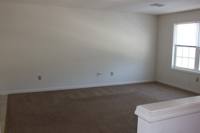 Área de sala de estar - Madison Apartments