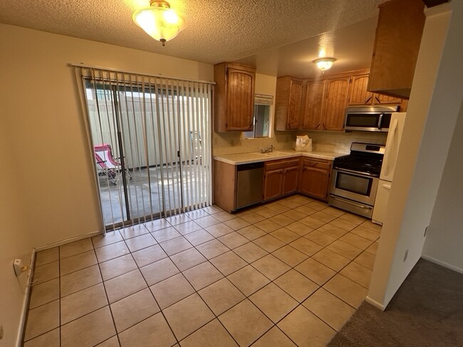 well quipped kitchen with view of patio - 3262 Montrose Ave